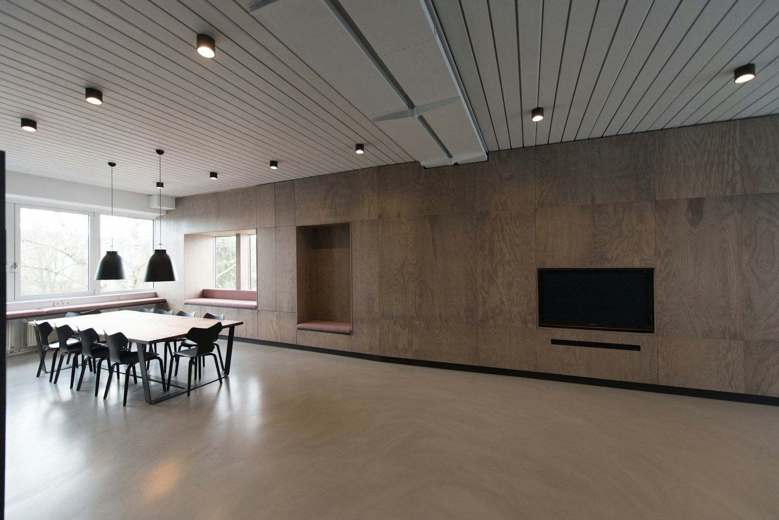 Modern office lounge with a table and chairs ready for a conversation