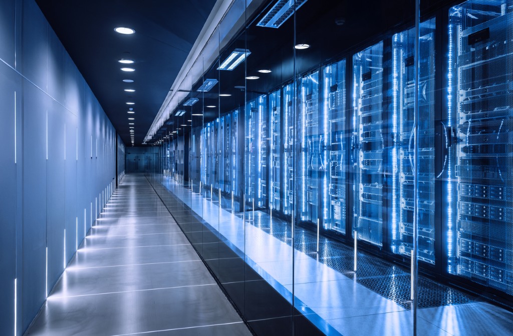 Modern data center corridor with server racks and blue lighting